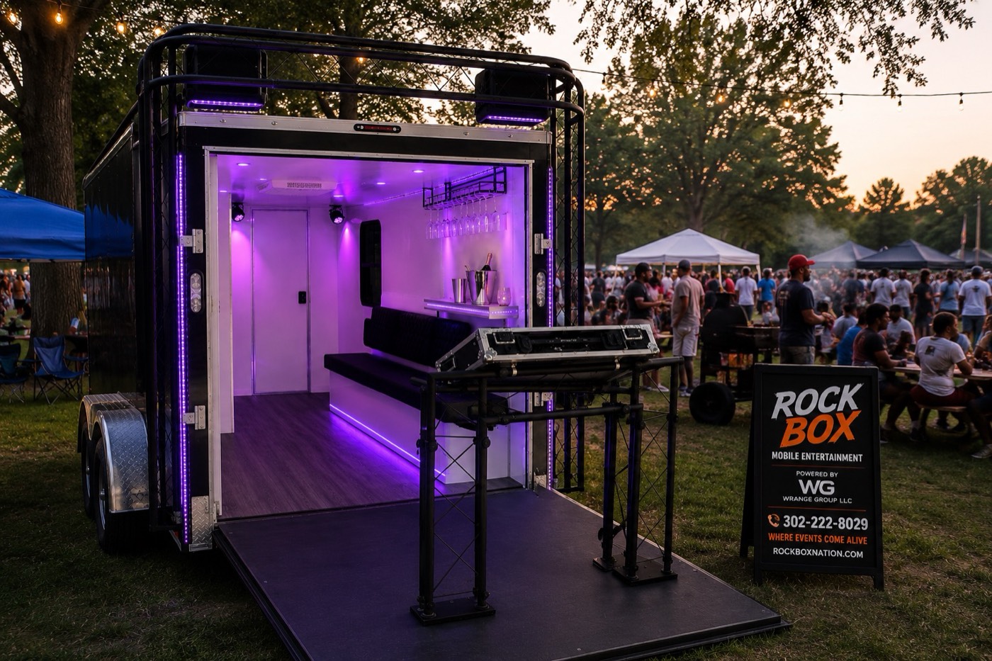 Inside the Rock Box Nation trailer โ purple-lit DJ booth and lounge, shown from the open rear